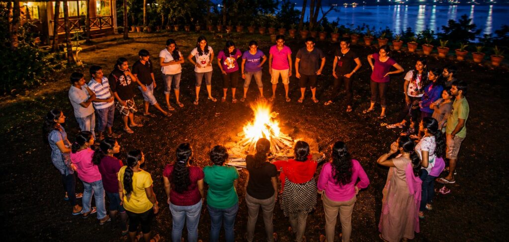 Wayanad Group Tour Packages 1 Group tour guests enjoying a campfire night at Wayanad Lakeshore Resort